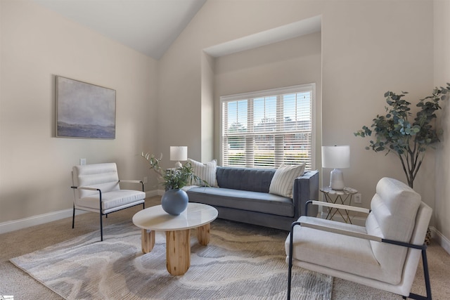 living area with carpet and lofted ceiling