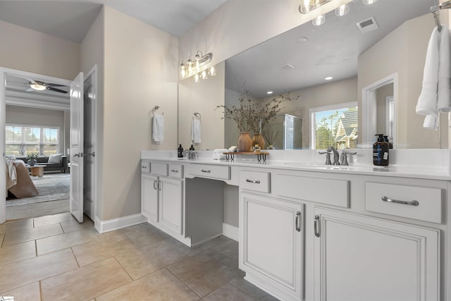 bathroom featuring vanity, tile patterned flooring, and a wealth of natural light