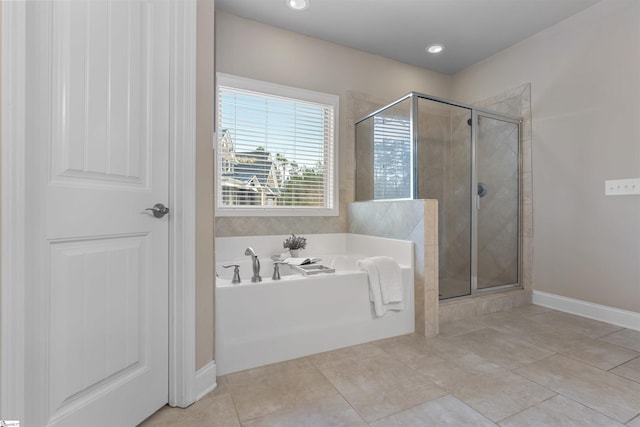 bathroom with tile patterned flooring and plus walk in shower