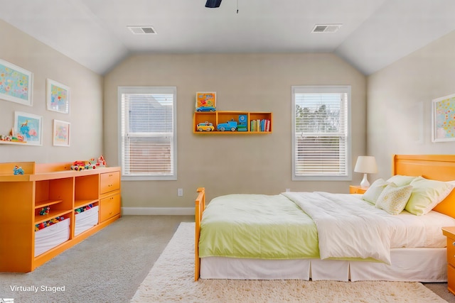 carpeted bedroom featuring vaulted ceiling and ceiling fan