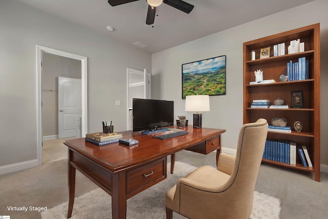 office space featuring light colored carpet and ceiling fan