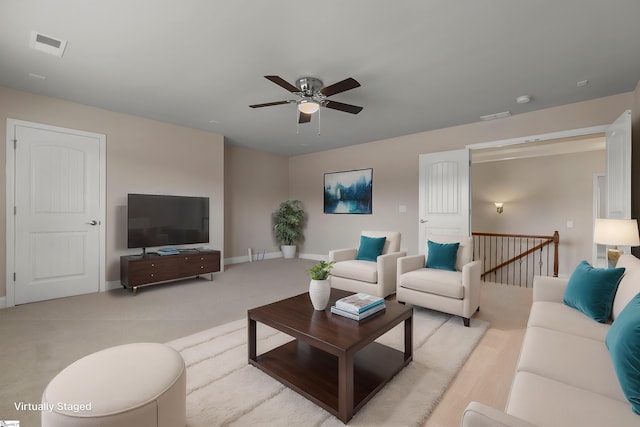 living room featuring ceiling fan