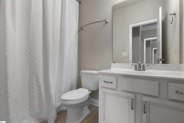 bathroom with tile patterned floors, toilet, and vanity