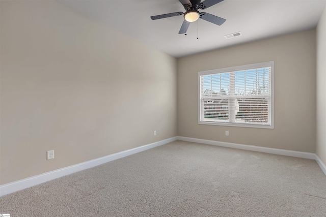 spare room with carpet flooring and ceiling fan