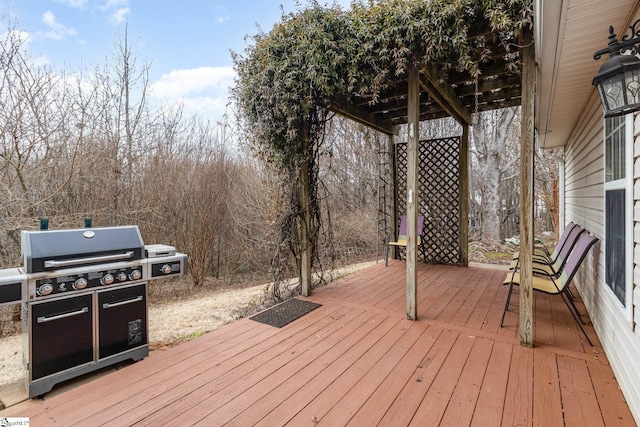 wooden deck featuring area for grilling