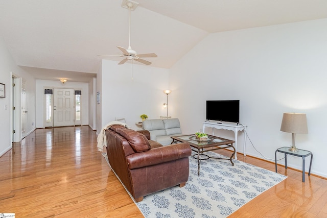 living room featuring ceiling fan, high vaulted ceiling, and light wood-type flooring