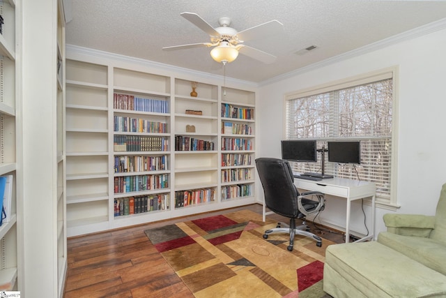 home office featuring hardwood / wood-style floors, crown molding, a textured ceiling, and ceiling fan