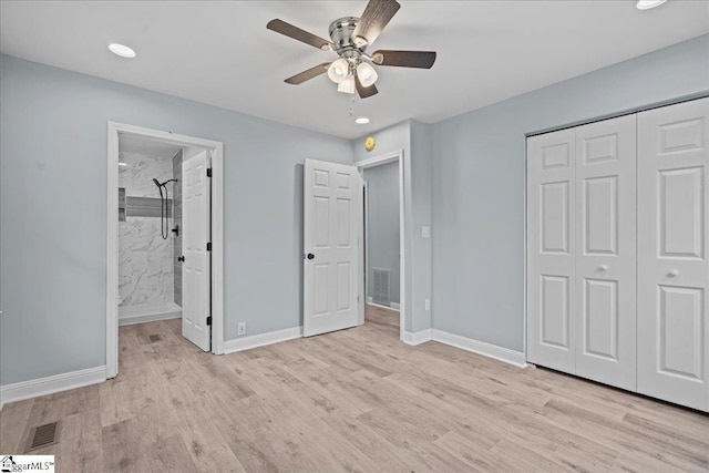 unfurnished bedroom with ceiling fan, ensuite bath, light hardwood / wood-style floors, and a closet