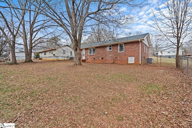 back of house featuring central air condition unit