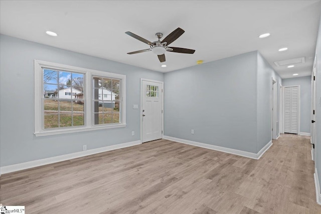 interior space with ceiling fan and light hardwood / wood-style floors