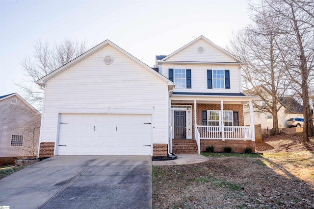 view of front property featuring a garage and a porch