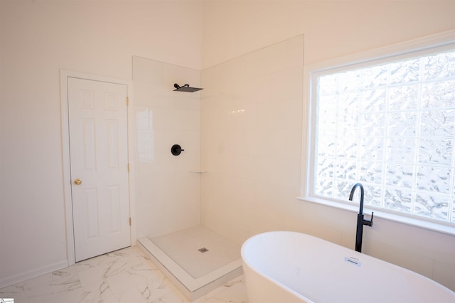 bathroom with shower with separate bathtub