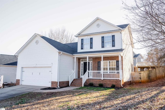 front of property featuring a garage and covered porch