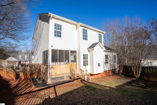 back of property featuring a sunroom