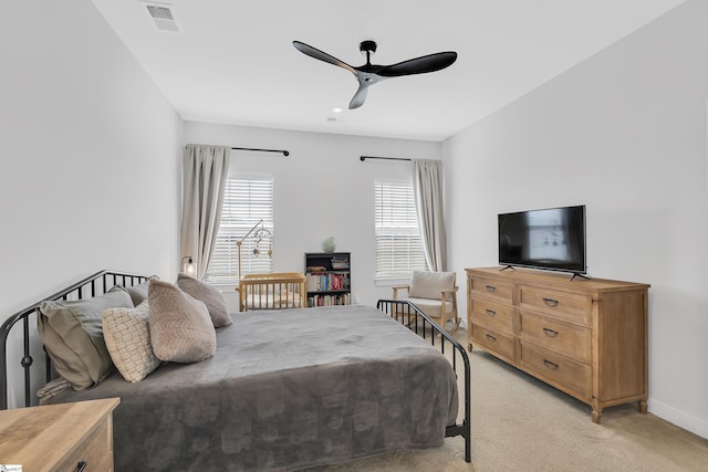 bedroom with ceiling fan and light colored carpet