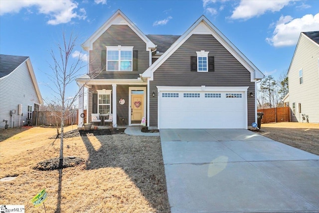 view of front of home with a garage and covered porch