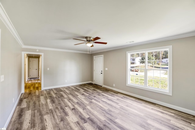 unfurnished room with ornamental molding, ceiling fan, and light hardwood / wood-style flooring