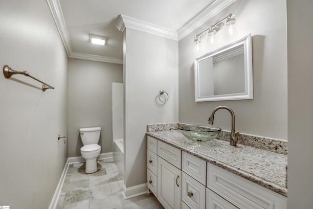 bathroom with crown molding, vanity, and toilet