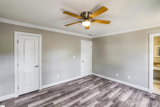 empty room with hardwood / wood-style flooring, ceiling fan, and ornamental molding