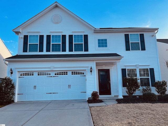 view of front of home with a garage