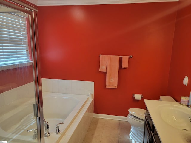 bathroom with tile patterned flooring, vanity, a relaxing tiled tub, and toilet