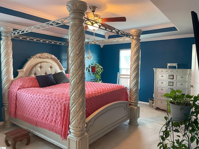 bedroom featuring ornamental molding, ceiling fan, and a tray ceiling