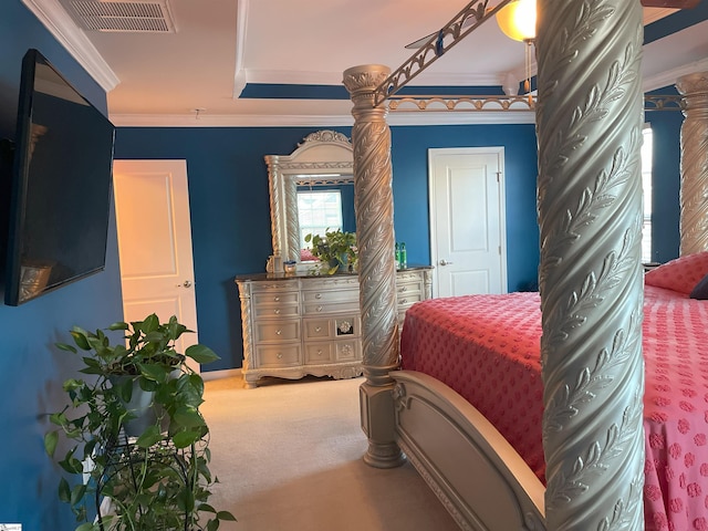 bedroom featuring ornamental molding and carpet
