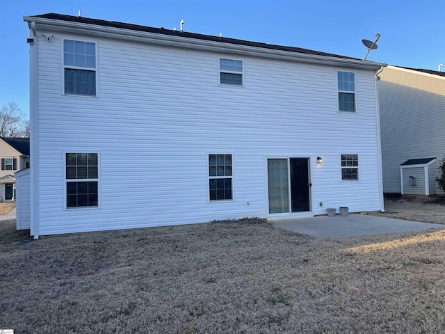 rear view of property featuring a patio area