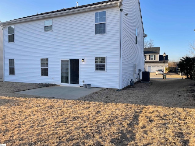 back of property featuring central AC and a patio area