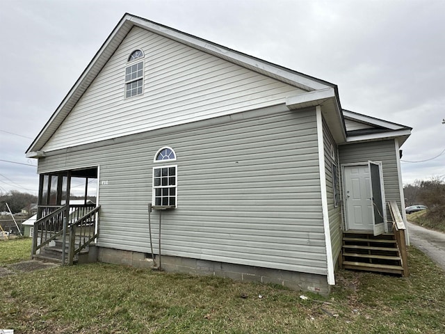 view of property exterior with a yard