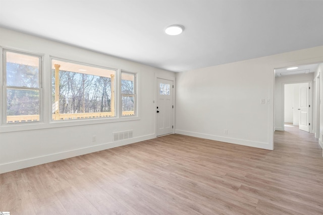 foyer with light wood-type flooring