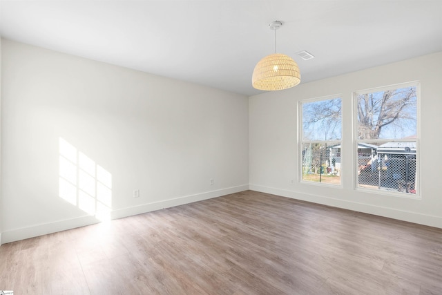 empty room featuring hardwood / wood-style floors