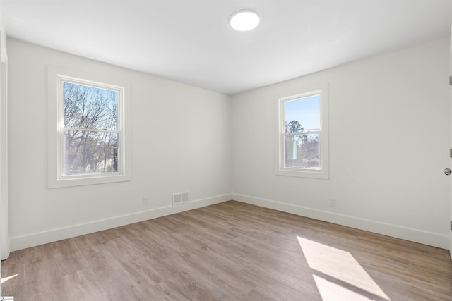 unfurnished room featuring light hardwood / wood-style flooring