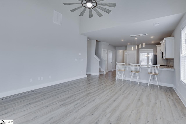 unfurnished living room featuring light hardwood / wood-style flooring