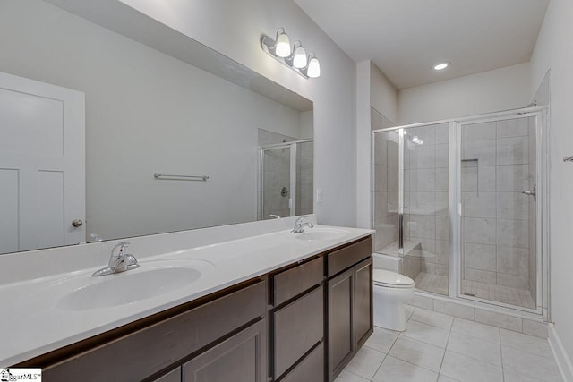 bathroom with walk in shower, tile patterned floors, toilet, and vanity