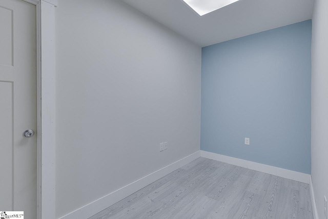 spare room with light hardwood / wood-style floors