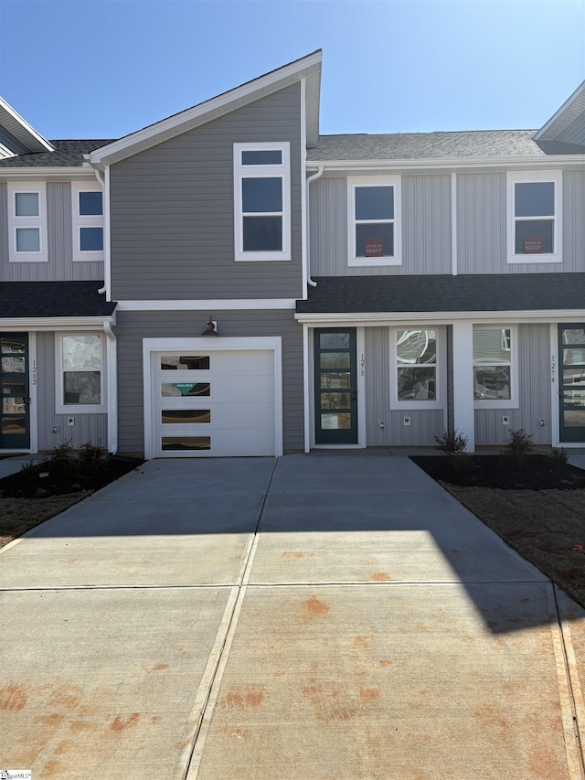 townhome / multi-family property featuring a garage