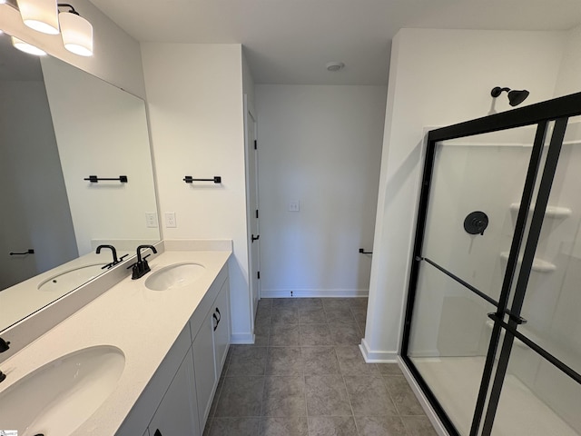 bathroom with tile patterned floors, vanity, and a shower