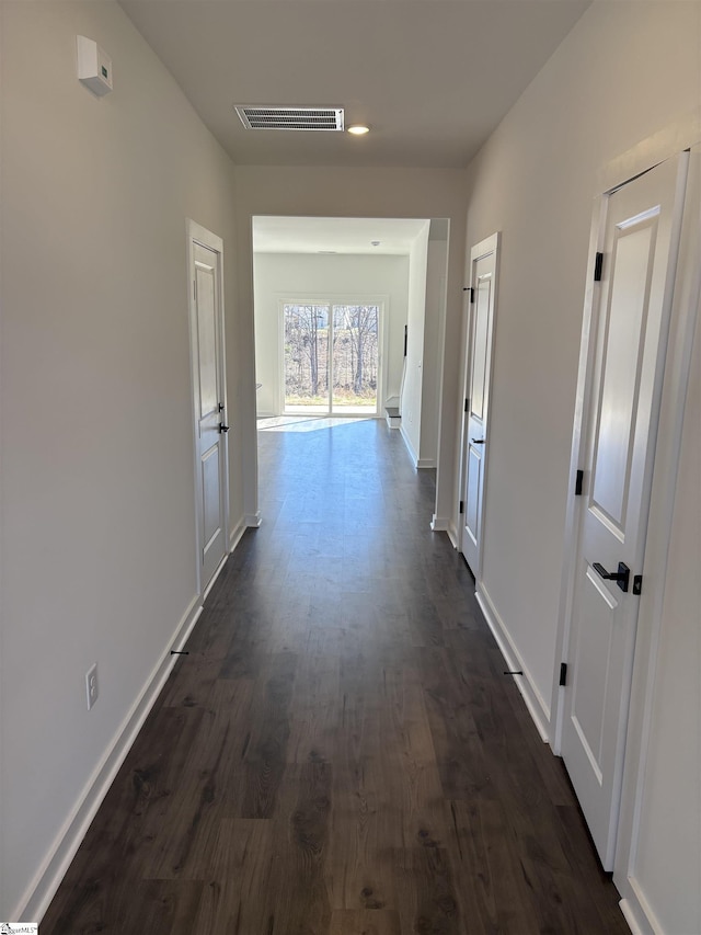 hall with dark wood-type flooring