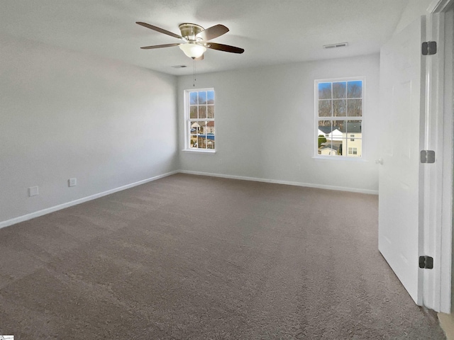 unfurnished room featuring carpet floors and ceiling fan