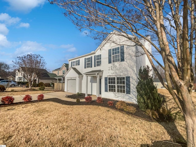 front facade with a garage and a front lawn