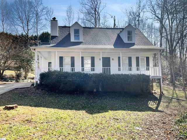 cape cod-style house with a porch and a front yard