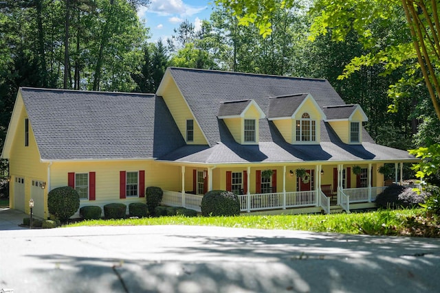 cape cod house featuring a porch