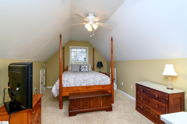 bedroom with vaulted ceiling, light colored carpet, and ceiling fan