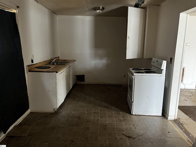 kitchen featuring sink, white cabinets, and white range with electric cooktop