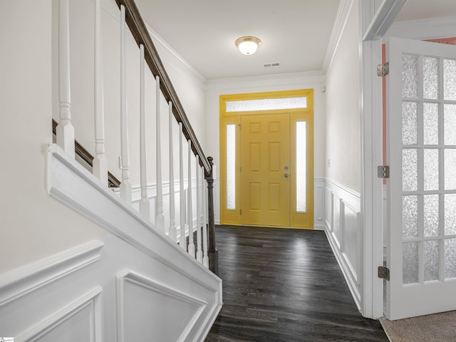 foyer entrance with dark hardwood / wood-style flooring and crown molding