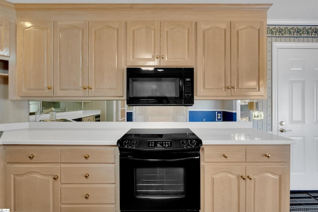 kitchen with light brown cabinetry and black appliances