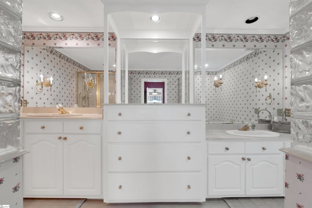 bathroom featuring vanity, ornamental molding, and walk in shower