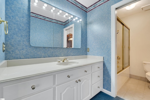 full bathroom with tile patterned flooring, vanity, shower / bath combination with glass door, and toilet