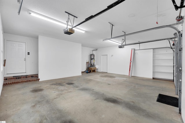 garage with a garage door opener and water heater
